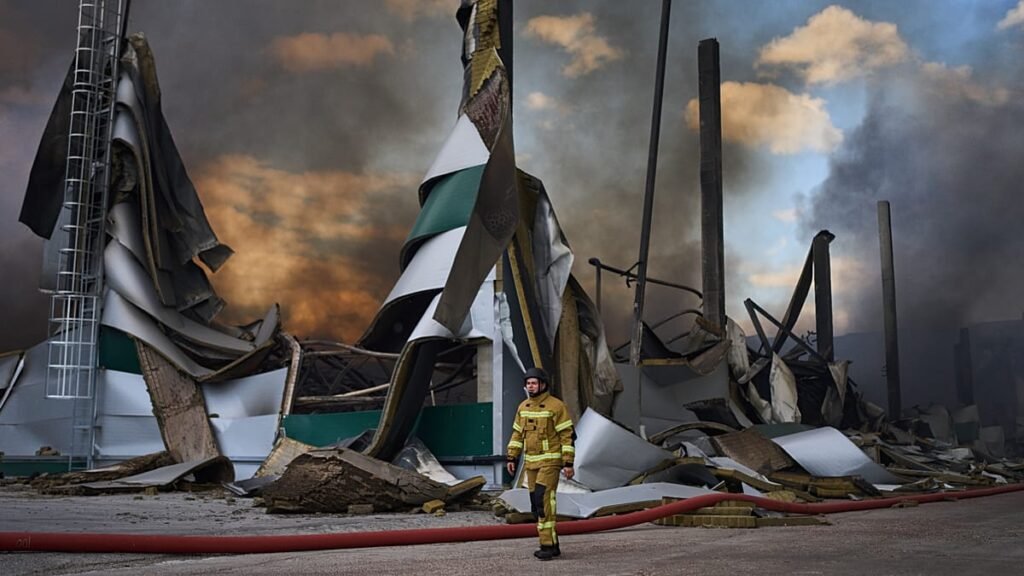 Russian drone strikes hit Ukraine as warehouses burn