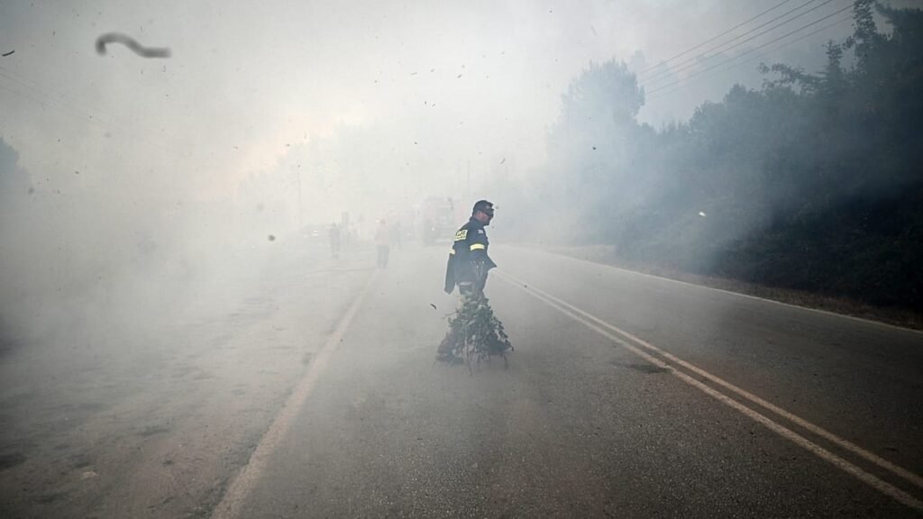 ‘Wall of fire’ forces sea evacuation in Greece as wildfires continue across Europe