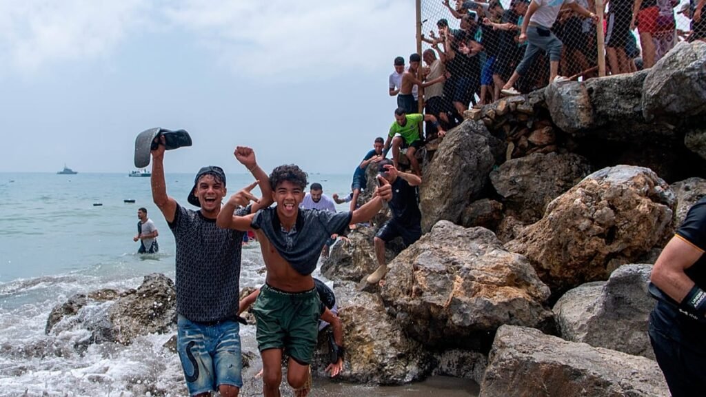At least 60,000 migrants cross into Spanish territory of Ceuta from Morocco in a single day
