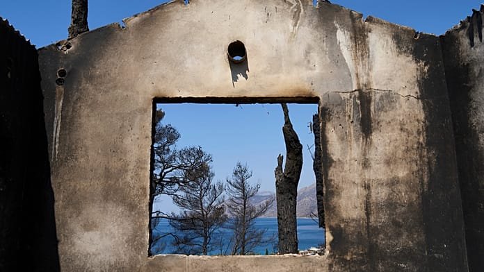 Firefighters scramble to contain fires outside Athens before high winds return