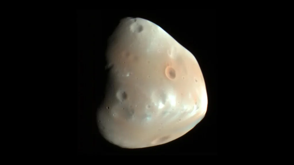 One asteroid strike may explain two mysteries of Mars’ moon Deimos